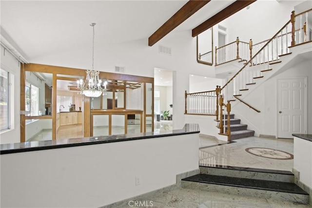 4205 Hermitage Dr, Hacienda Heights, CA 91745 - stairs featuring a chandelier, beamed ceiling, and a towering ceiling