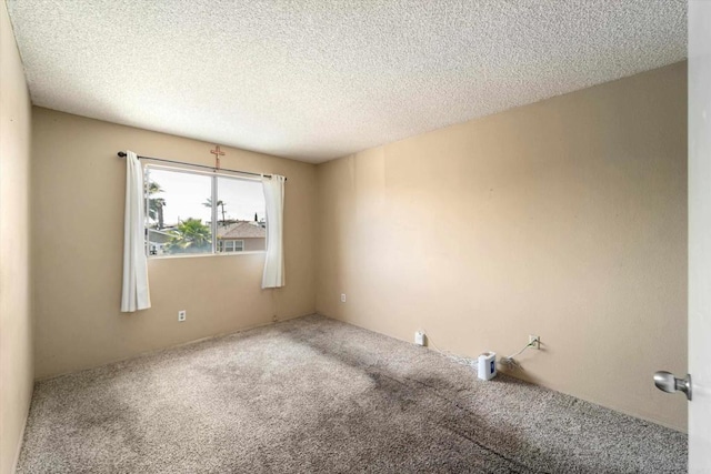 4643 Cherokee Ave, San Diego, CA 92116 - carpeted empty room featuring a textured ceiling