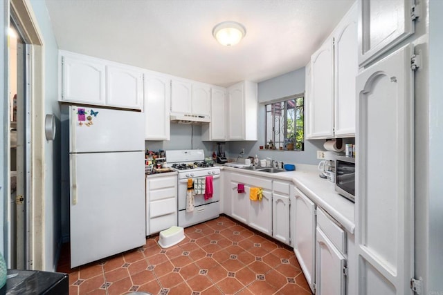 4643 Cherokee Ave, San Diego, CA 92116 - kitchen with white appliances, under cabinet range hood, white cabinets, a sink, and light countertops
