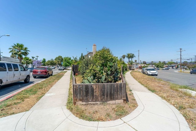4643 Cherokee Ave, San Diego, CA 92116 - view of asphalt street featuring sidewalks, street lights, and curbs