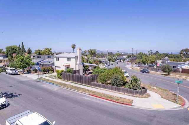 4643 Cherokee Ave, San Diego, CA 92116 - view of asphalt street with sidewalks, curbs, and a residential view