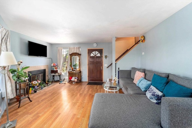 4643 Cherokee Ave, San Diego, CA 92116 - living area featuring wood finished floors, stairs, and a glass covered fireplace