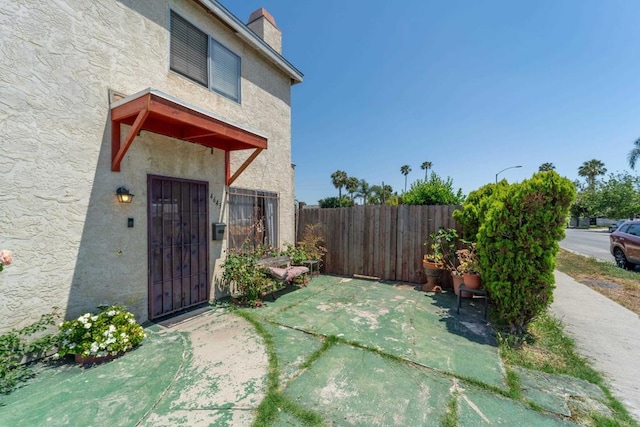 4643 Cherokee Ave, San Diego, CA 92116 - entrance to property with stucco siding, a chimney, and a patio area