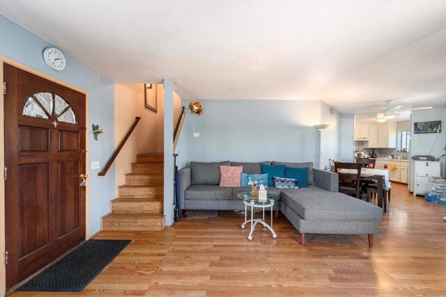 4643 Cherokee Ave, San Diego, CA 92116 - living area featuring light wood finished floors, stairs, and a ceiling fan