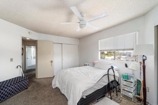 4643 Cherokee Ave, San Diego, CA 92116 - bedroom with a textured ceiling, a closet, carpet floors, and a ceiling fan