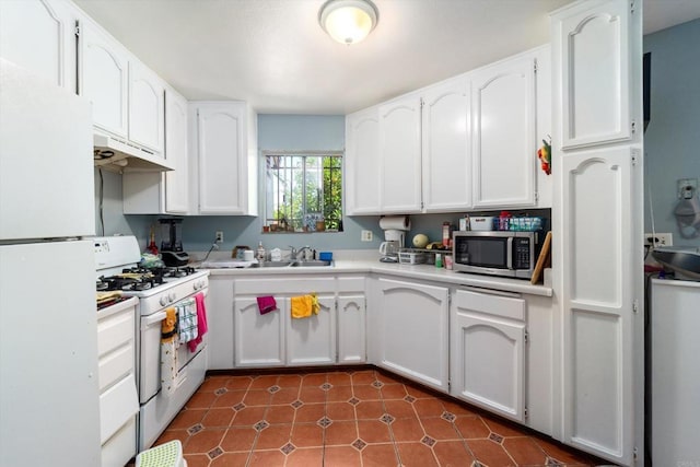 4643 Cherokee Ave, San Diego, CA 92116 - kitchen featuring white appliances, white cabinets, under cabinet range hood, a sink, and light countertops