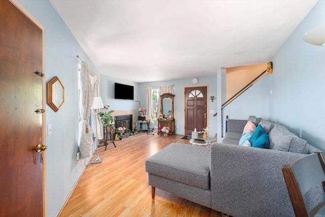 4643 Cherokee Ave, San Diego, CA 92116 - living room with light wood-style floors and a tiled fireplace
