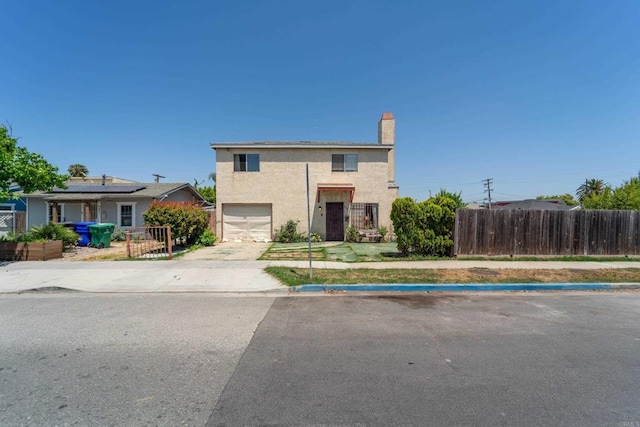 4643 Cherokee Ave, San Diego, CA 92116 - traditional-style home with a garage, a chimney, driveway, and stucco siding