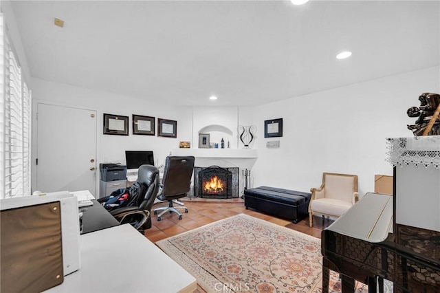 12045 Falcon Crest Way, Porter Ranch, CA 91326 - home office with recessed lighting, a warm lit fireplace, and plenty of natural light