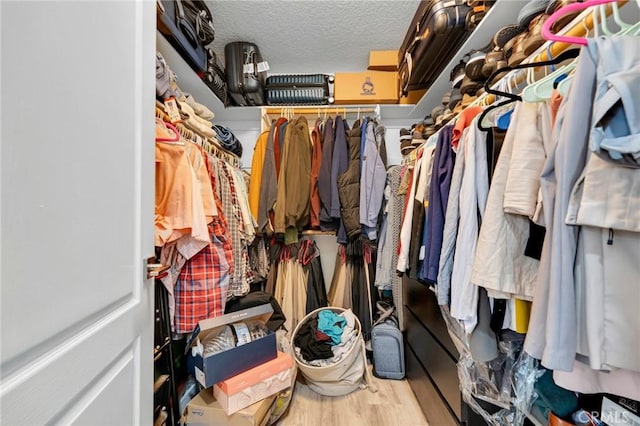 12045 Falcon Crest Way, Porter Ranch, CA 91326 - walk in closet with wood finished floors
