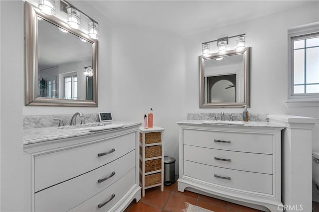 12045 Falcon Crest Way, Porter Ranch, CA 91326 - full bath with two vanities, toilet, and tile patterned flooring