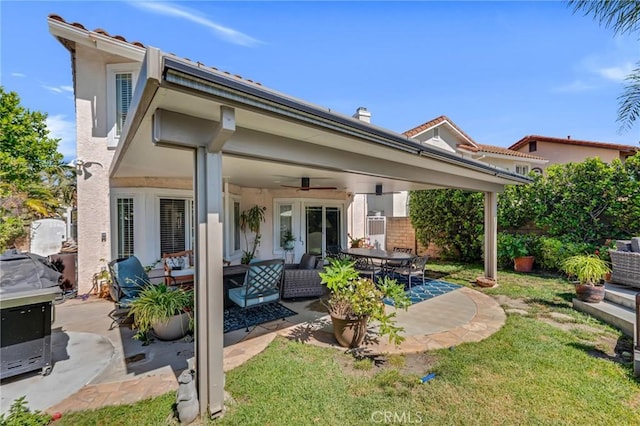 12045 Falcon Crest Way, Porter Ranch, CA 91326 - back of house featuring ceiling fan, a patio, an outdoor living space, a lawn, and stucco siding