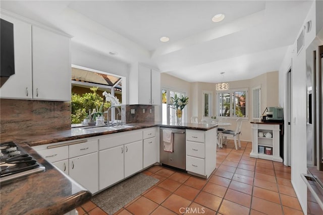 12045 Falcon Crest Way, Porter Ranch, CA 91326 - kitchen with stainless steel appliances, a sink, decorative backsplash, light tile patterned floors, and a peninsula