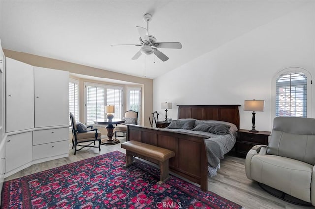 12045 Falcon Crest Way, Porter Ranch, CA 91326 - bedroom featuring light wood-style floors, multiple windows, lofted ceiling, and ceiling fan