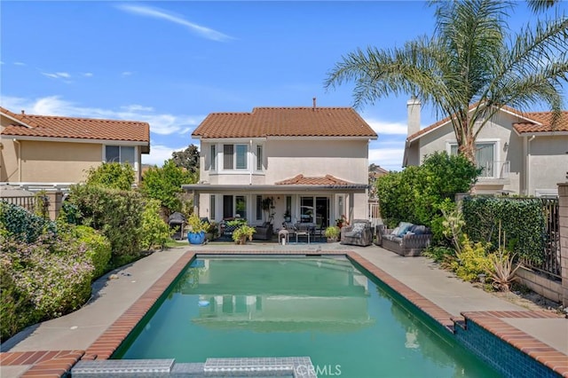 12045 Falcon Crest Way, Porter Ranch, CA 91326 - back of property with a tile roof, stucco siding, a patio area, a pool with connected hot tub, and a fenced backyard