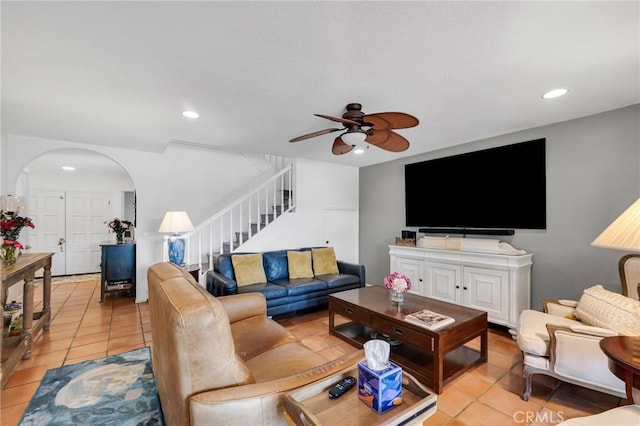 12045 Falcon Crest Way, Porter Ranch, CA 91326 - living area with arched walkways, light tile patterned flooring, stairs, a ceiling fan, and recessed lighting