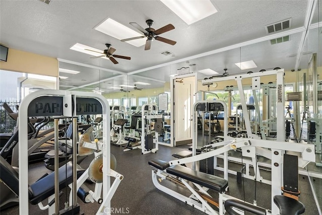 30902 Clubhouse Dr Unit 28C, Laguna Niguel, CA 92677 - workout area with plenty of natural light, ceiling fan, a skylight, crown molding, and a textured ceiling