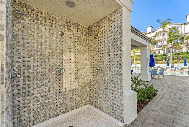 30902 Clubhouse Dr Unit 28C, Laguna Niguel, CA 92677 - view of exterior entry featuring a community pool and a patio