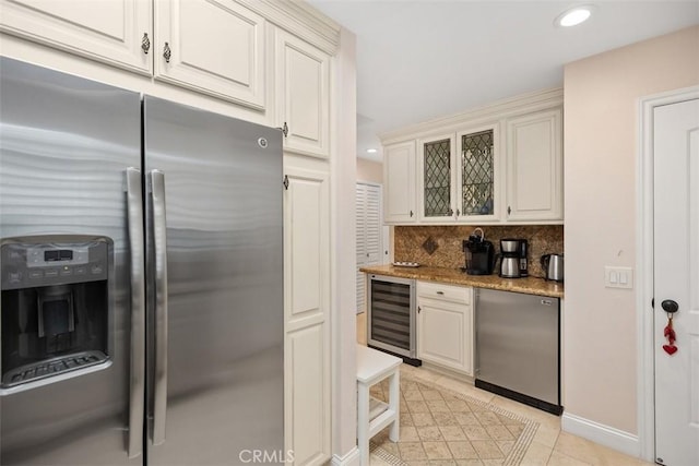 30902 Clubhouse Dr Unit 28C, Laguna Niguel, CA 92677 - kitchen with stainless steel fridge with ice dispenser, wine cooler, backsplash, fridge, and glass insert cabinets