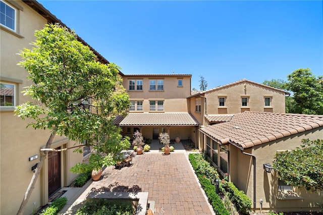 61 Silverado, Irvine, CA 92618 - view of front of property with stucco siding, a tile roof, and a patio