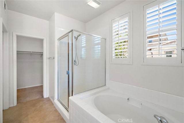 61 Silverado, Irvine, CA 92618 - bathroom featuring a stall shower, a bath, a spacious closet, and tile patterned flooring