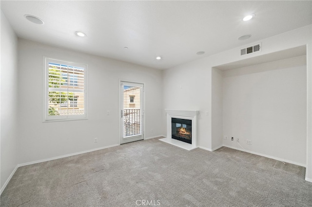 61 Silverado, Irvine, CA 92618 - unfurnished living room with carpet, a glass covered fireplace, and recessed lighting