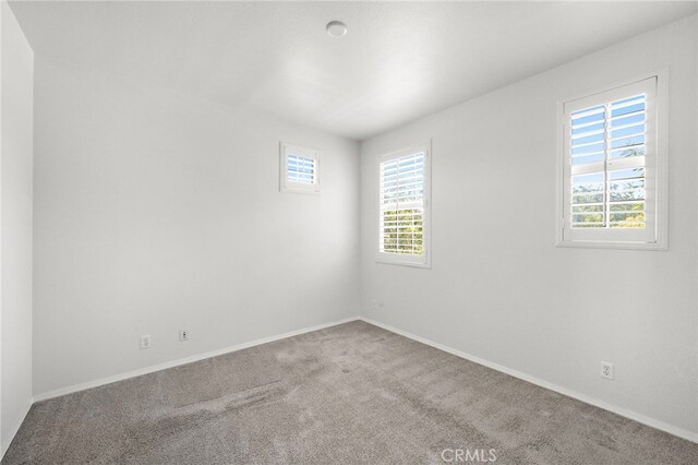 61 Silverado, Irvine, CA 92618 - empty room with plenty of natural light and carpet flooring