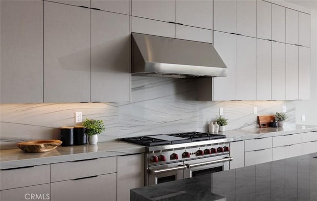 18510 Boulder Blf, Silverado, CA 92676 - kitchen with range with two ovens, under cabinet range hood, tasteful backsplash, modern cabinets, and white cabinets