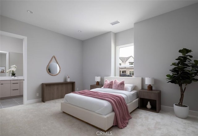 18510 Boulder Blf, Silverado, CA 92676 - bedroom featuring light carpet, connected bathroom, and baseboards