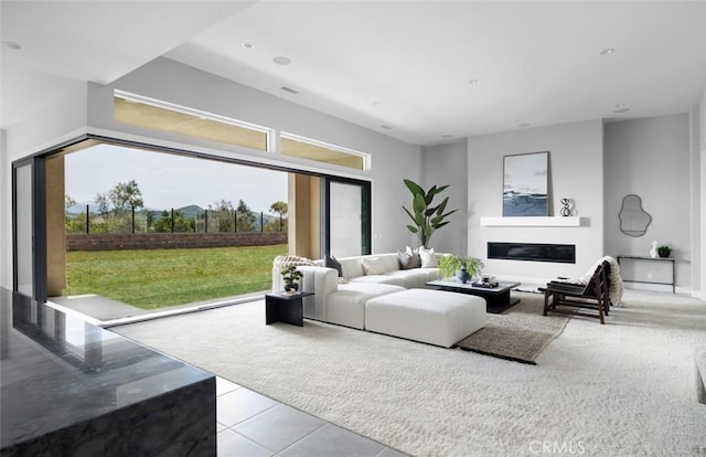 18510 Boulder Blf, Silverado, CA 92676 - living area with light tile patterned floors and a glass covered fireplace