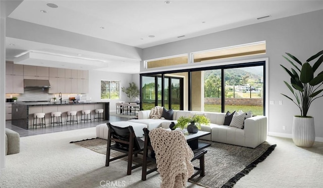 18510 Boulder Blf, Silverado, CA 92676 - living area with light colored carpet, baseboards, and recessed lighting
