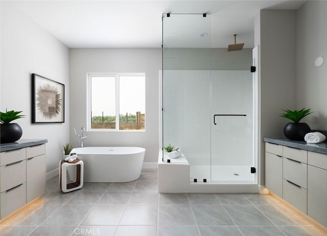 18510 Boulder Blf, Silverado, CA 92676 - bathroom featuring a stall shower, a freestanding tub, tile patterned floors, vanity, and baseboards