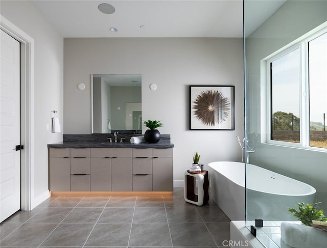 18510 Boulder Blf, Silverado, CA 92676 - bathroom with vanity, a freestanding tub, tile patterned floors, and baseboards