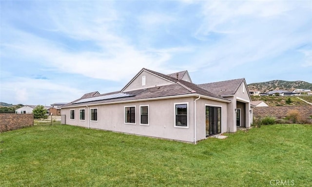 18510 Boulder Blf, Silverado, CA 92676 - rear view of property with stucco siding, solar panels, and a tile roof