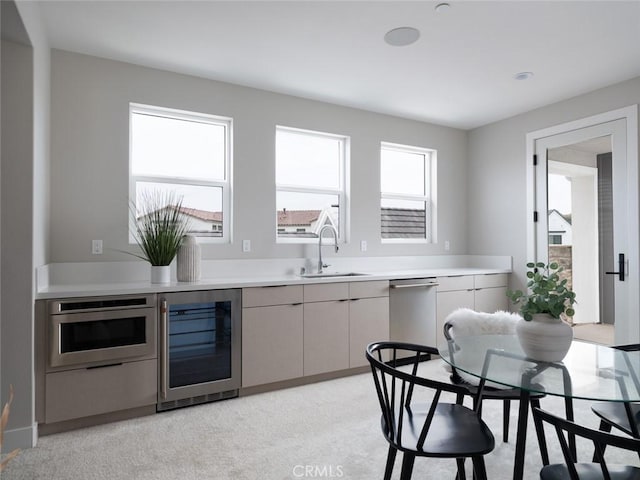 18510 Boulder Blf, Silverado, CA 92676 - kitchen with stainless steel appliances, beverage cooler, a sink, and light countertops