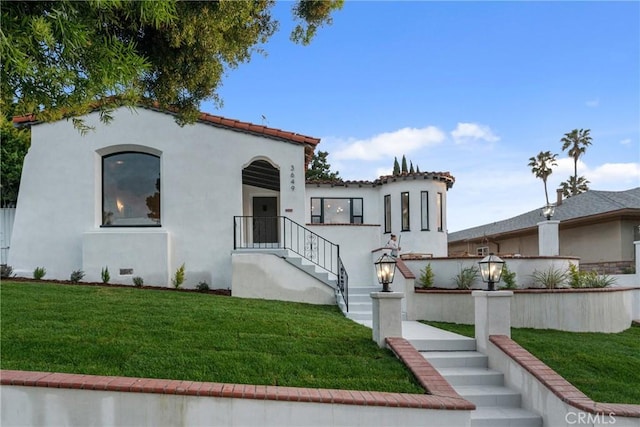 3649 Mount Vernon Dr, View Park, CA 90008 - mediterranean / spanish home featuring a front lawn, stucco siding, and a tiled roof