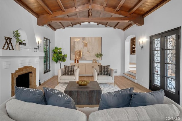 3649 Mount Vernon Dr, View Park, CA 90008 - living room featuring wood ceiling, wood finished floors, arched walkways, a fireplace, and baseboards