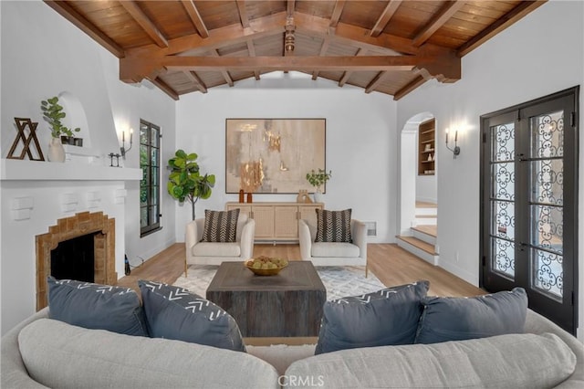 3649 Mount Vernon Dr, View Park, CA 90008 - living room featuring wooden ceiling, wood finished floors, arched walkways, and a fireplace