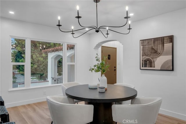3649 Mount Vernon Dr, View Park, CA 90008 - dining space with arched walkways, baseboards, light wood-style floors, a chandelier, and recessed lighting