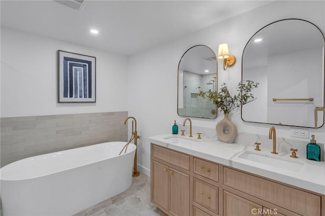 3649 Mount Vernon Dr, View Park, CA 90008 - full bath featuring double vanity, a freestanding tub, and recessed lighting
