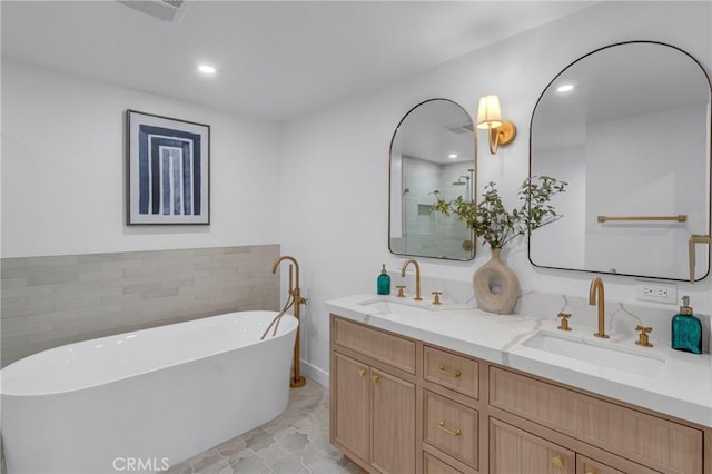 3649 Mount Vernon Dr, View Park, CA 90008 - full bathroom with double vanity, a freestanding tub, and recessed lighting