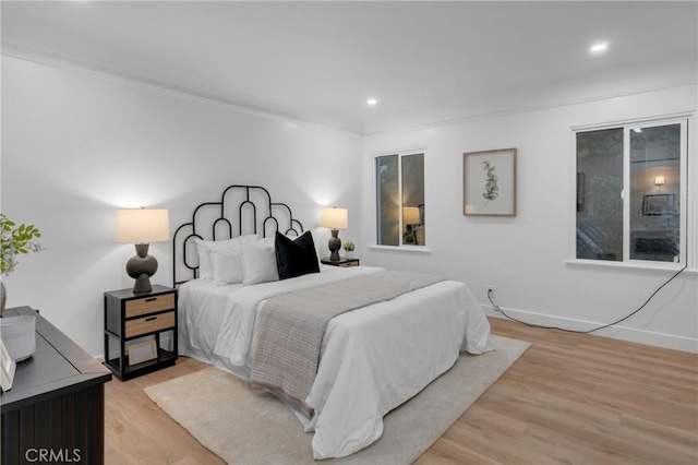 3649 Mount Vernon Dr, View Park, CA 90008 - bedroom featuring light wood-style floors, recessed lighting, and crown molding