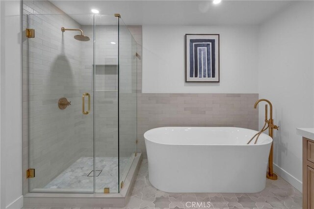 3649 Mount Vernon Dr, View Park, CA 90008 - full bath featuring a freestanding bath, a shower stall, vanity, recessed lighting, and baseboards