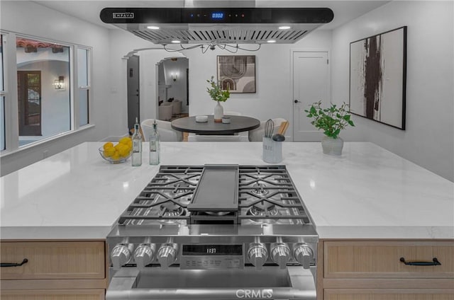 3649 Mount Vernon Dr, View Park, CA 90008 - kitchen with stainless steel gas range, wall chimney exhaust hood, and arched walkways