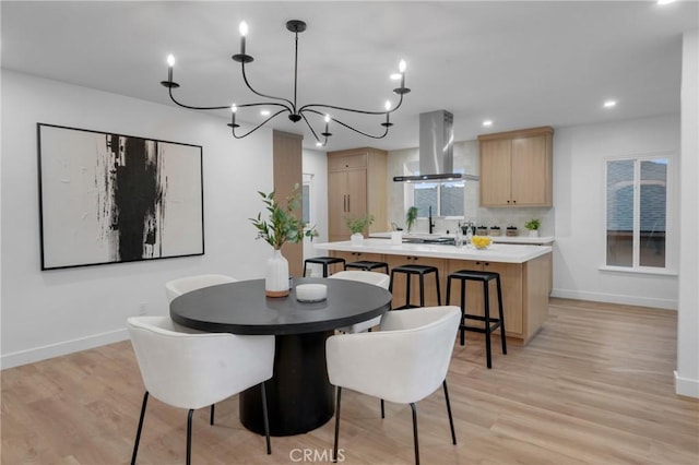 3649 Mount Vernon Dr, View Park, CA 90008 - dining space with baseboards, light wood-style floors, a chandelier, and recessed lighting