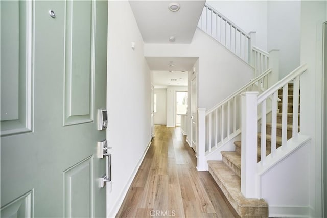 12392 Sandy Ct, Whittier, CA 90602 - entryway featuring wood finished floors and stairway