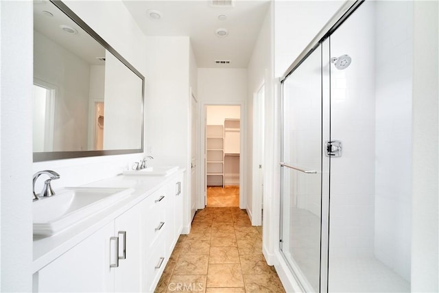 12392 Sandy Ct, Whittier, CA 90602 - bathroom featuring a stall shower, double vanity, and a walk in closet