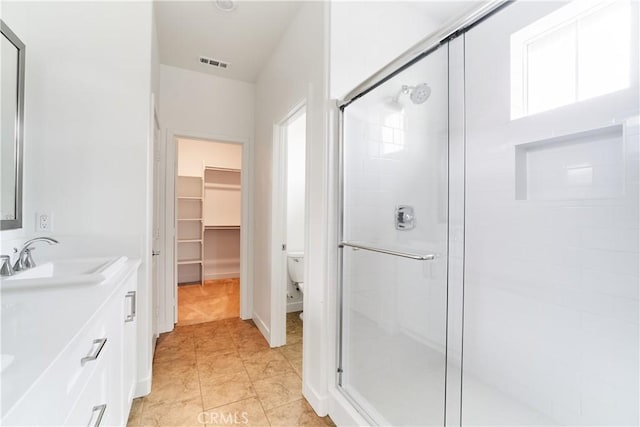 12392 Sandy Ct, Whittier, CA 90602 - bathroom with a stall shower, double vanity, and plenty of natural light