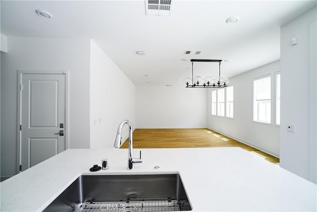 12392 Sandy Ct, Whittier, CA 90602 - kitchen featuring wood finished floors and light countertops