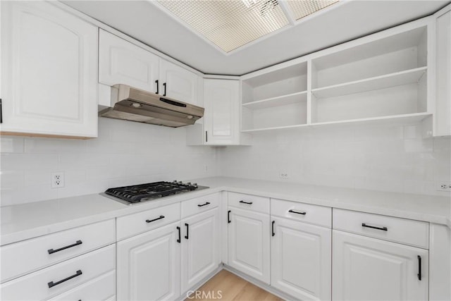 4426 Ventura Canyon Ave Unit 204, Sherman Oaks, CA 91423 - kitchen with under cabinet range hood, open shelves, and backsplash